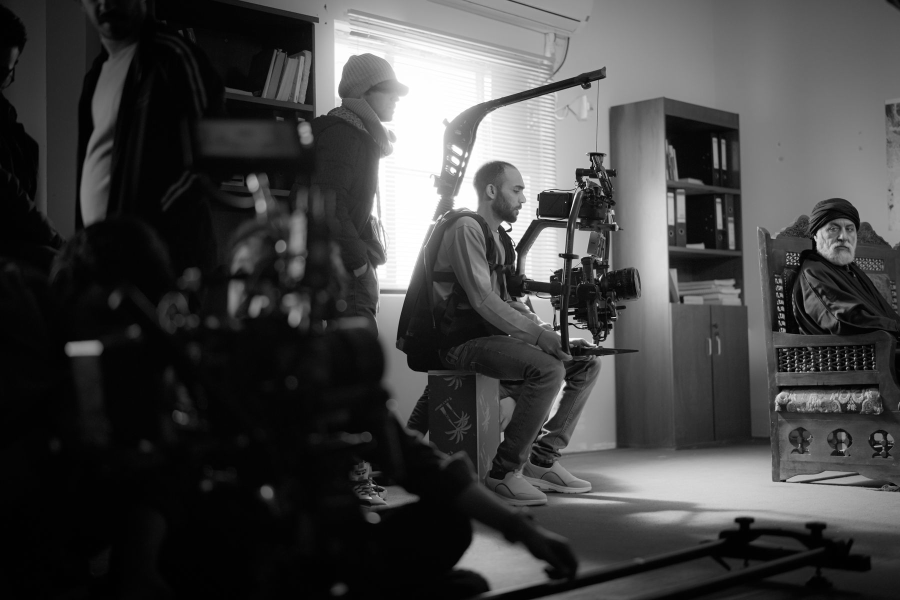 Film production crew working with a camera on set