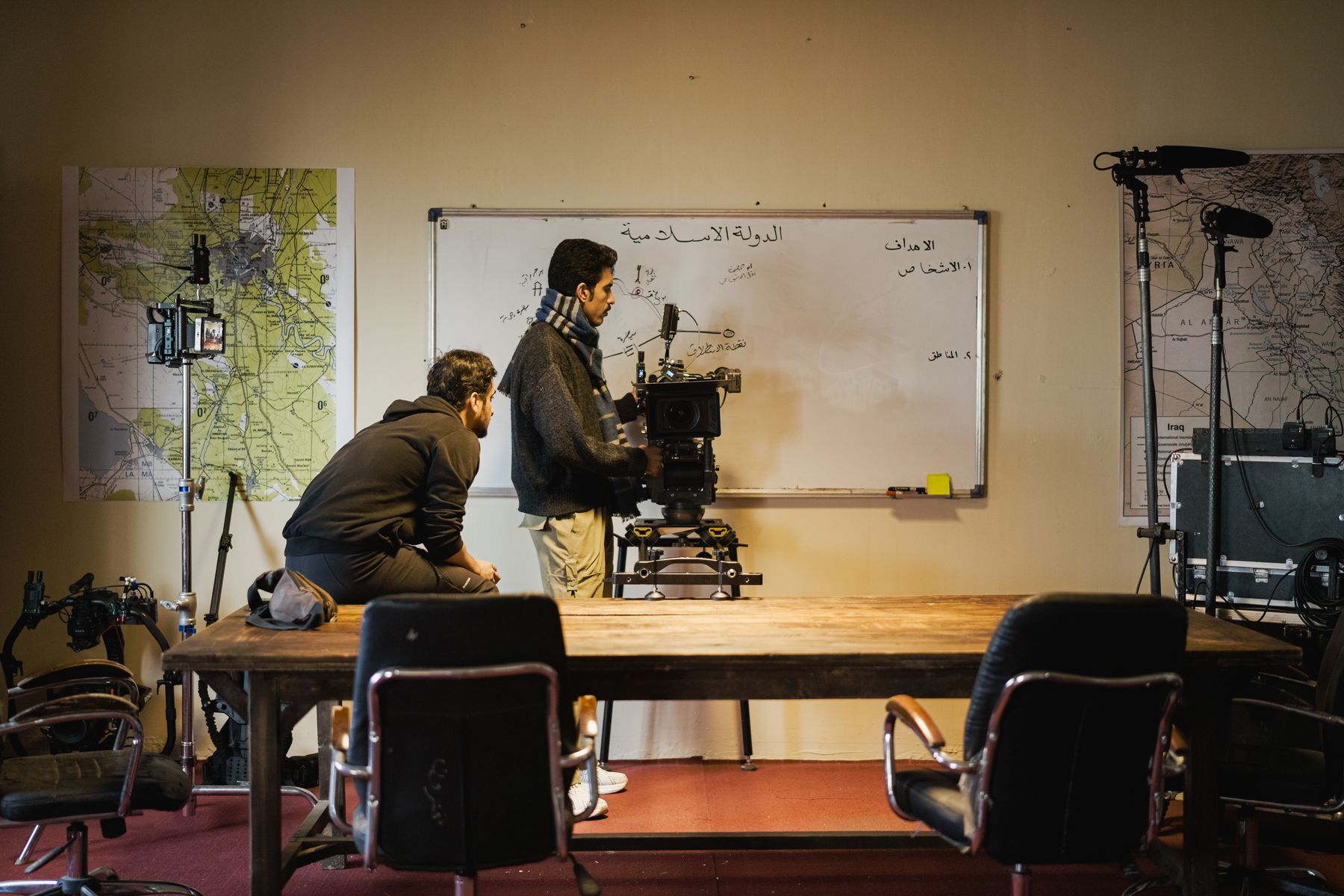 Production team coordinating a shoot day on set